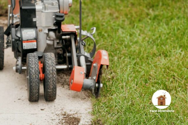 Powered edger cutting a perfect line along the pavement and grass