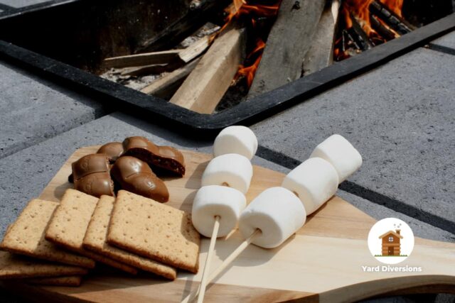Marshmallows being prepared for smores on abackyard fire pit
