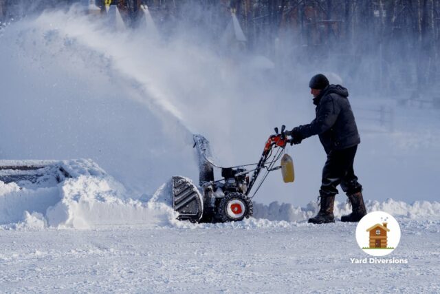 Snow Blower cleaning up the yard in high snow