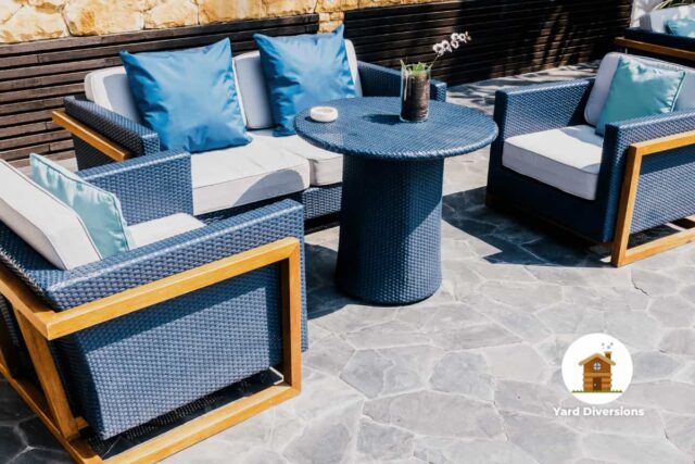 blue outdoor patio set with table with wicket construction