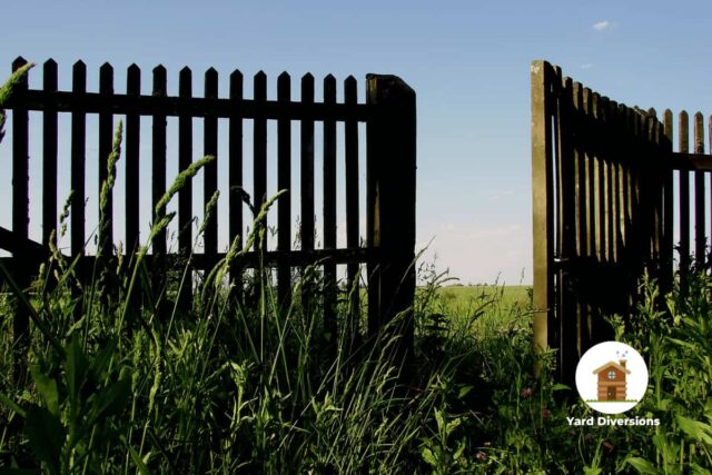 Wooden gate which is opening in instead of out