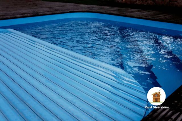 Pool cover being deployed to close off the pool from the outside