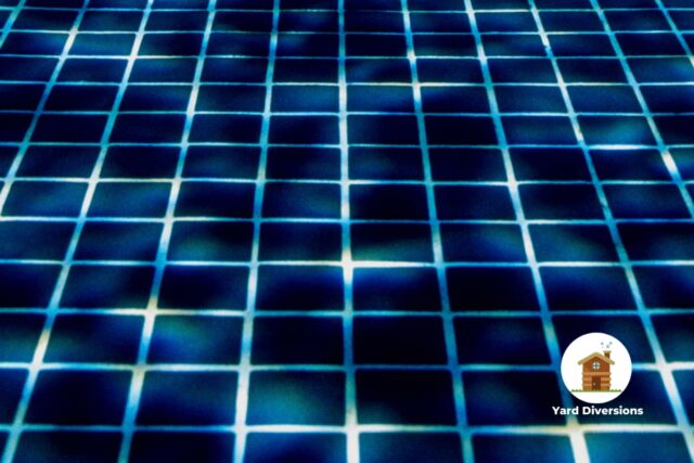 Black tile at the bottom of a pool