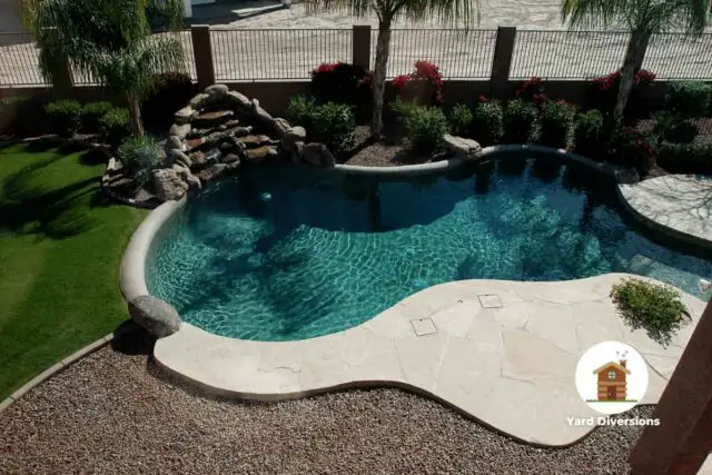 Amazing backyard pool without any pool fence installed to protect entrance