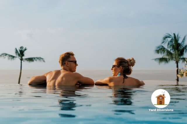 gyuy and girl relaxing and talking at the edge of an infinity pool