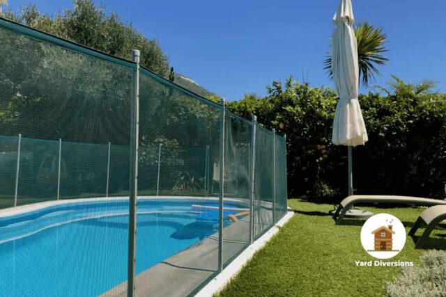 Tall fence surrounding the pool to protect from accidents