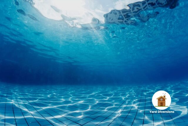 looking up from underwater at the pool with crystal clear water