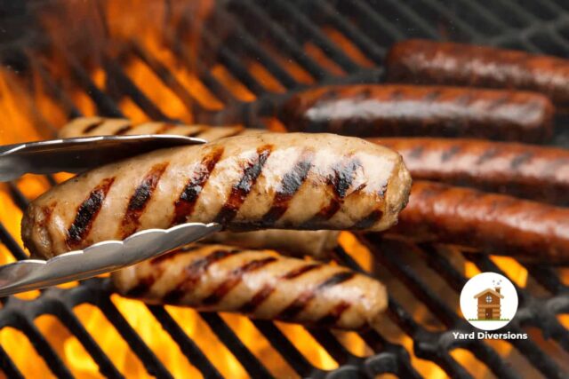 Perfectly grill marked brats coming fresh off the grill