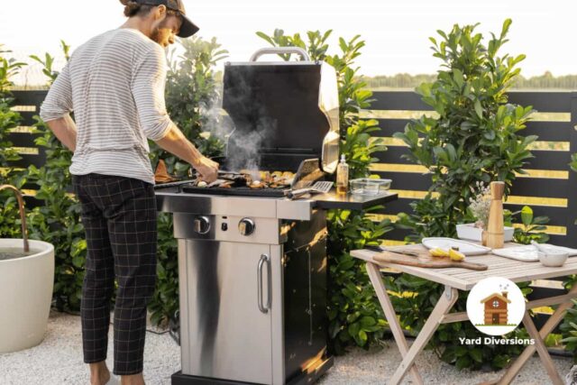 Man grilling in his backyard with a grill close to a fence, a easy anchor point!