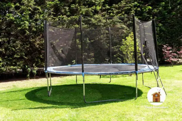 New trampoline in the backyard with a net for fall protection