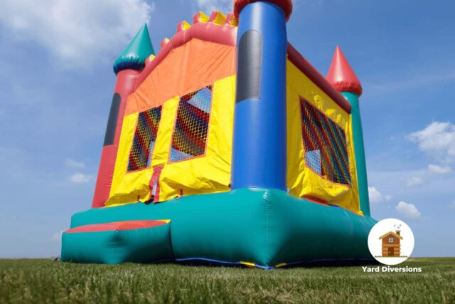 Bounce house on the grass low perspective pointing towards the sky from the ground