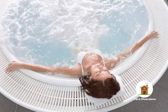 Woman laying back enjoying the warmth of the hot tub water