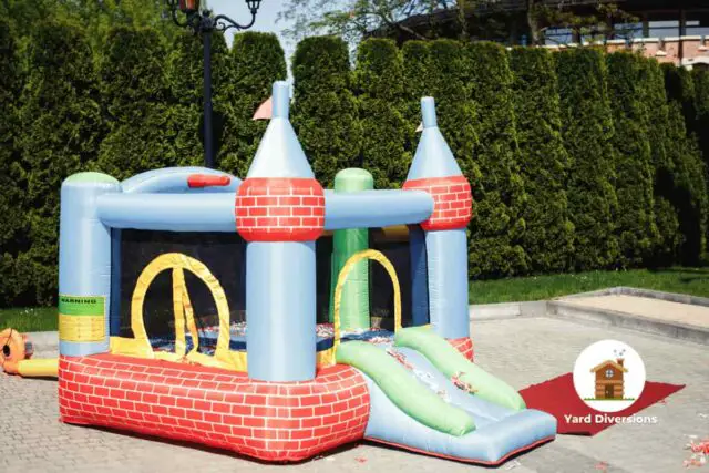 Kids small bounce house on a patio inflated and ready for play