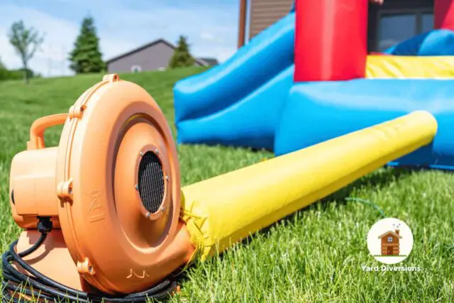 Closeup of a blower connected to a bounce house