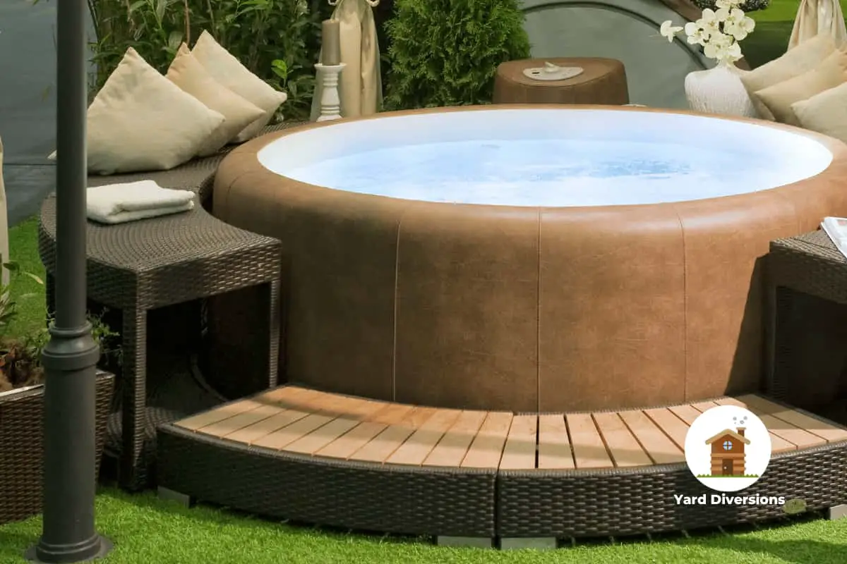 Nicely setup inflatable hot tub with a surrounding seating area outside