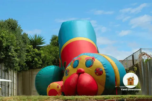 Bounce house that looks like a bug in the backyard for fun and games