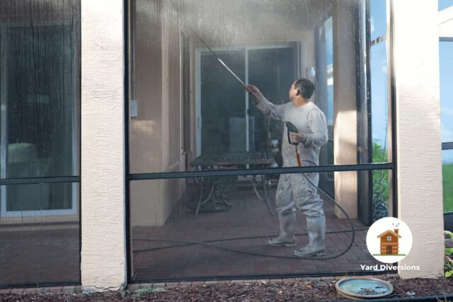 Cleaning a patio screen enclosure with a pressure washer