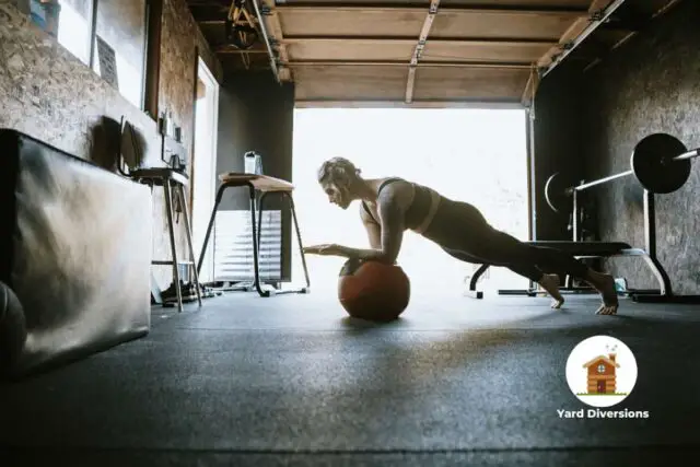 Woman doing balancing exercises in her garage gym