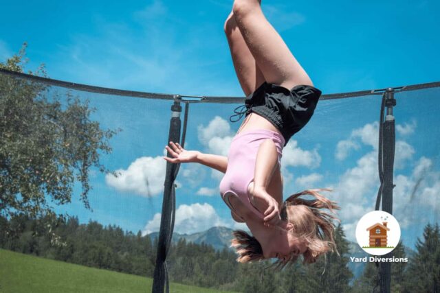Woman fully upside down completing a full front flip