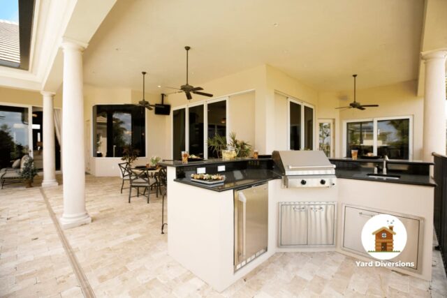 Nice outdoor kitchen with a huge covered outdoor patio