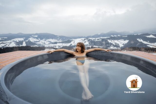 Woman relaxing in the most fabulous hot tub location in the mountains