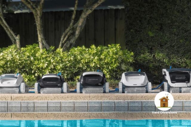 The many Dolphin branded pool cleaners aligned in a row on the edge of a pool