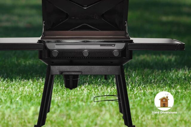 Close up on a Traeger Flatrock flat top grill on grassy yard
