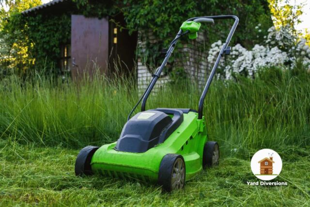 Electric lawn mower on very tall grass