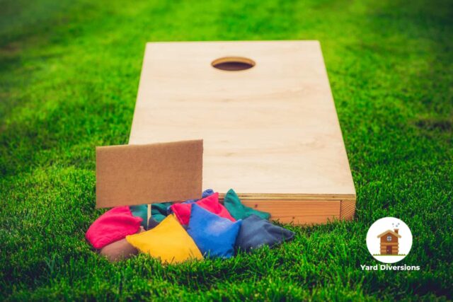 Cornhole board with bean bags ready to toss