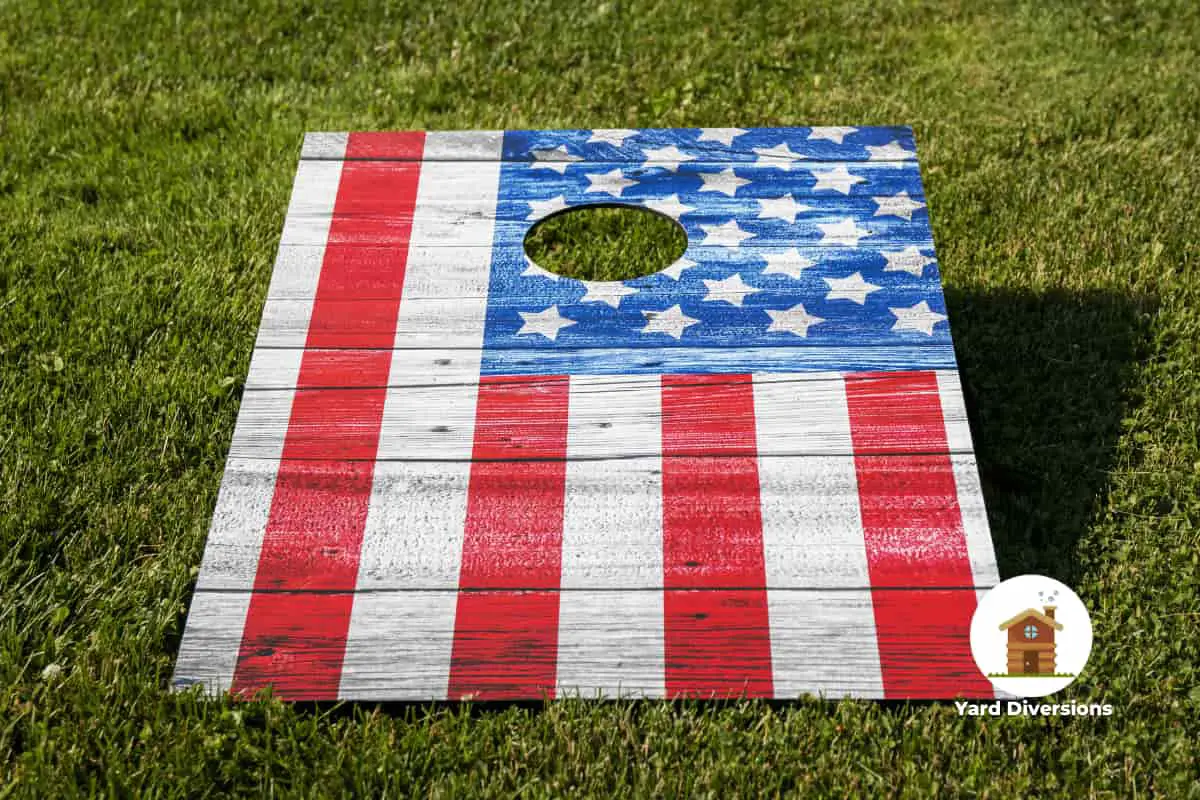 Patriotic cornhole board without any bean bags on it using the stars and stripes for visual appeal
