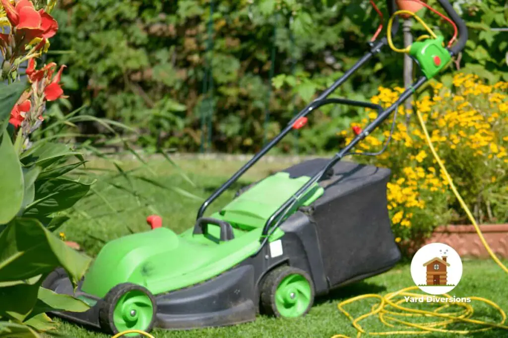 Corded Electric Lawn Mower sitting off on the lawn