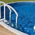 Closeup of an above ground pool from custom dcking and access ladder